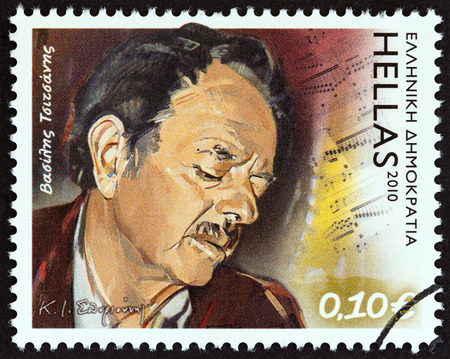 GREECE - CIRCA 2010: A stamp printed in Greece from the "Folk Music" issue shows songwriter and bouzouki player Vassilis Tsitsanis (1915-1984), circa 2010.のeditorial素材