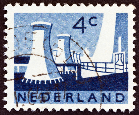 NETHERLANDS - CIRCA 1963: A stamp printed in the Netherlands shows Cooling towers, State mines, Limburg, circa 1963.のeditorial素材