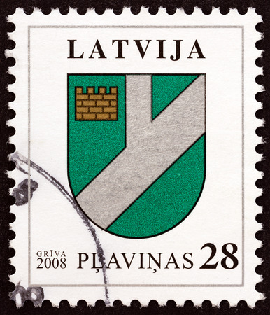 LATVIA - CIRCA 2008: A stamp printed in Latvia from the "Coat of Arms " issue shows Coat of Arms of Plavinas, circa 2008.のeditorial素材