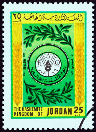 JORDAN - CIRCA 1981: A stamp printed in Jordan from the "World Food Day" issue shows FAO (Food and Agriculture Organization of the United Nations) emblem, circa 1981.のeditorial素材