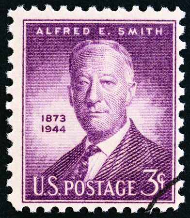 USA - CIRCA 1945: A stamp printed in USA issued for the 1st anniversary of the death of Alfred E.Smith shows Alfred E.Smith, Governor of New York, circa 1945.のeditorial素材
