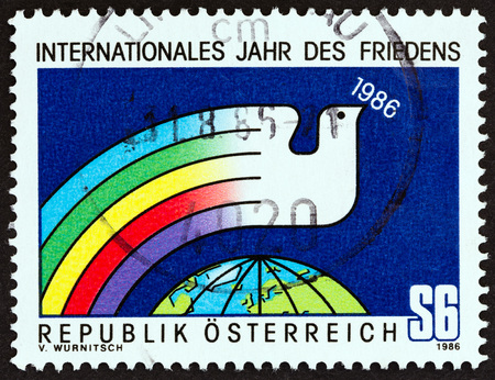 AUSTRIA - CIRCA 1986: A stamp printed in Austria from the "International Peace Year" issue shows Dove and Globe, circa 1986.のeditorial素材