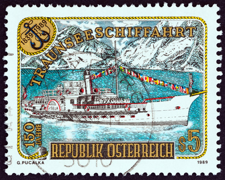 AUSTRIA - CIRCA 1989: A stamp printed in Austria issued for the 150th anniversary of passenger shipping on Traunsee lake shows Gisela (paddle-steamer), circa 1989.のeditorial素材
