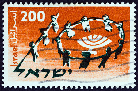 ISRAEL - CIRCA 1958: A stamp printed in Israel issued for the 1st World Conference of Jewish Youth, Jerusalem shows dancing children forming number 10, circa 1958.のeditorial素材