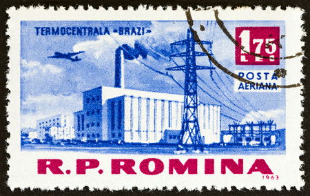 ROMANIA - CIRCA 1963: A stamp printed in Romania from the "Socialist Achievements" issue shows Brazi thermic power station, circa 1963.のeditorial素材