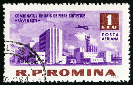 ROMANIA - CIRCA 1963: A stamp printed in Romania from the "Socialist Achievements" issue shows Savinesti chemical works, circa 1963.のeditorial素材