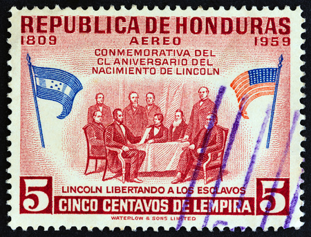 HONDURAS - CIRCA 1959: A stamp printed in Honduras from the 150th Anniversary of the Birth of Abraham Lincoln issue shows Lincoln at conference to free slaves, circa 1959.のeditorial素材
