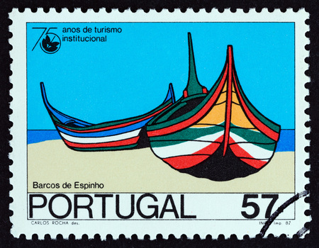 PORTUGAL - CIRCA 1987: A stamp printed in Portugal from the 75th anniversary of Organized Tourism issue shows Fishing boats, Espinho, circa 1987.のeditorial素材