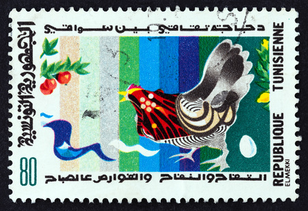 TUNISIA - CIRCA 1982: A stamp printed in Tunisia from the Stories and Songs from Tunisia issue shows Chicken, circa 1982.のeditorial素材