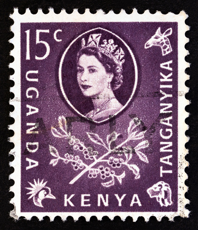 KENYA UGANDA TANGANYIKA - CIRCA 1960: A stamp printed in Kenya Uganda Tanganyika shows Queen Elizabeth II and Coffee (Coffea arabica), circa 1960.のeditorial素材