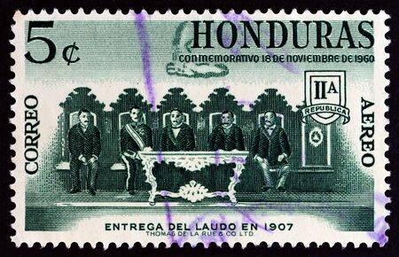 HONDURAS - CIRCA 1961: A stamp printed in Honduras from the Settlement of Boundary Dispute with Nicaragua issue shows Arbitration commission delivering its award, circa 1961.のeditorial素材