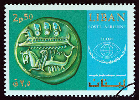 LEBANON - CIRCA 1969: A stamp printed in Lebanon from the 20th Anniversary of International Museums Council. Exhibits in National Museum, Beirut issue shows Silver Coin from Byblos, circa 1969.のeditorial素材