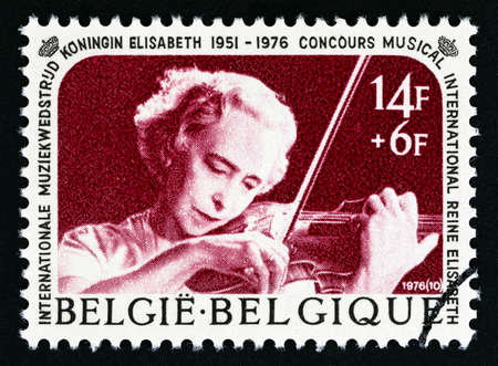 BELGIUM - CIRCA 1976: A stamp printed in Belgium issued for the Queen Elizabeth Concours, International Music Contest shows Violinist, circa 1976.のeditorial素材