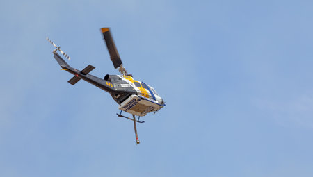 Athens, Greece, June 4, 2022: A firefighting McDermott Aviation Bell 214B helicopter operates in...