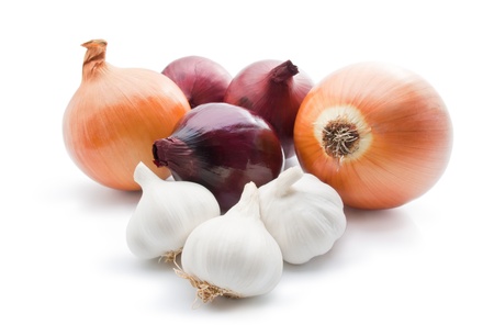 Garlic and onions. Arrangement of different varieties of onions with garlic close-up isolated on white backgroundの写真素材