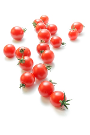 		Cherry tomatoes. Fresh ripe cherry tomatoes scattered isolated on white background.の写真素材