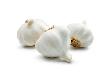Garlic. Three cloves of garlic arranged on a white background close-up.の写真素材