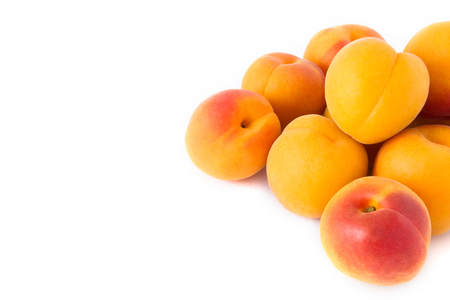Fresh apricots, cropped, isolated on whiteの写真素材