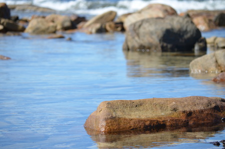tranquil seawater pool with rocksの写真素材