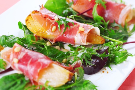 Appetizer with caramelized pears, walnuts and prosciutto の写真素材