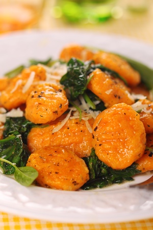 Pumpkin gnocchi with spinach and parmesan cheeseの写真素材