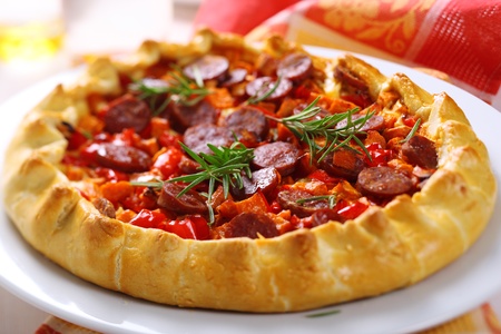 Pie with sweet potato, sausage and red pepperの写真素材