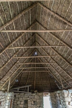 Thatch roof in storage house at the Inca site of Machu Picchu in Peru.の写真素材