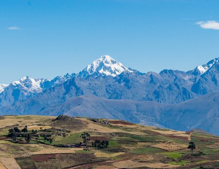 The inescapable snow peaked Andes in the Sacred Valley of Peru.の写真素材