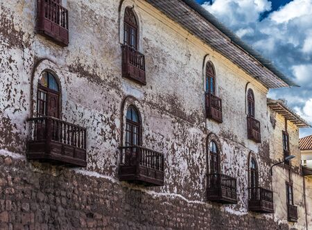 Wood carved balconies in elegant decay in Cusco, Peru.の写真素材