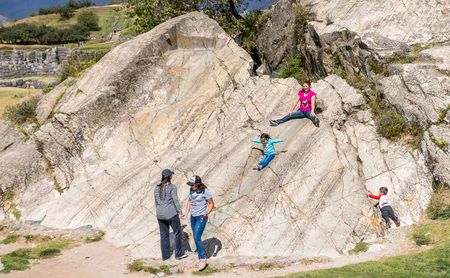 Locals playing at Sacsayhuaman rock formations at Cusco, Peru.のeditorial素材