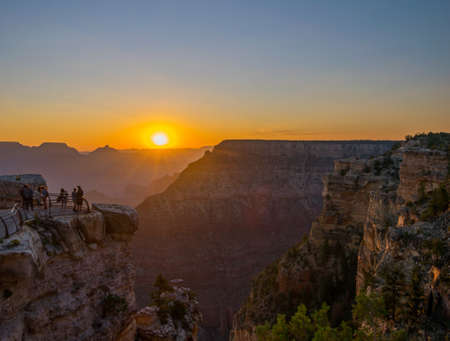 Enjoying the View at Sunrise at South Rim Grand Canyon National Park Mather Pointの写真素材
