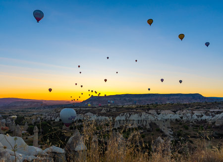 Hot Air Balloons Over Love Valley in Cappadocia, Turkey at Dawn.の写真素材