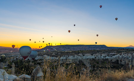 Hot Air Balloons Over Love Valley in Cappadocia, Turkey at Dawn.の写真素材