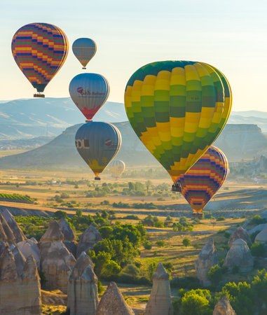 Hot Air Balloons Over Love Valley in Cappadocia, Turkey at Dawn.の写真素材