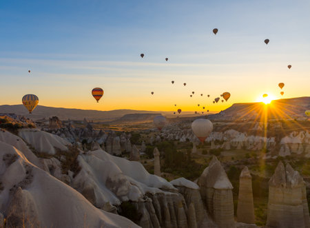 Hot Air Balloons Over Love Valley in Cappadocia, Turkey at Dawn.の写真素材