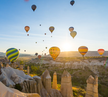 Hot Air Balloons Over Love Valley in Cappadocia, Turkey at Dawn.の写真素材