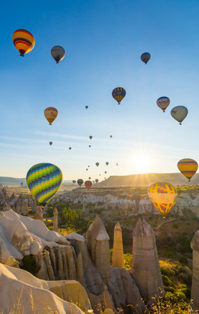 Hot Air Balloons Over Love Valley in Cappadocia, Turkey at Dawn.の写真素材