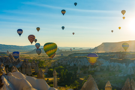 Hot Air Balloons Over Love Valley in Cappadocia, Turkey at Dawn.の写真素材