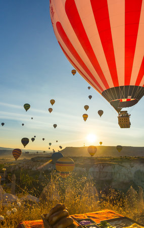 Hot Air Balloons Over Love Valley in Cappadocia, Turkey at Dawn.の写真素材