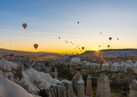 Hot Air Balloons Over Love Valley in Cappadocia, Turkey at Dawn.の写真素材