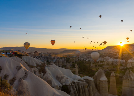 Hot Air Balloons Over Love Valley in Cappadocia, Turkey at Dawn.の写真素材