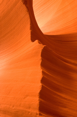 Sunlight reflected off of the red rock curves of the Antelope Canyon Slot Canyons in Page, Arizona. This shot was taken in Lower Antelope Canyon. 

Antelope Canyon is Mother Nature's work in progress. The canyon is carved from the flash flood waters of thの写真素材