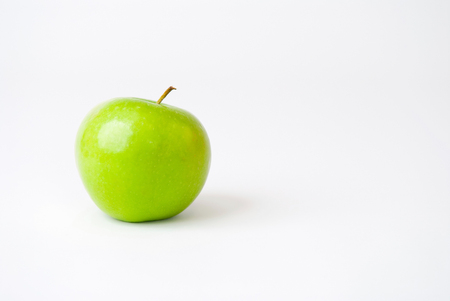 Green apple isolated on white. Room for textの写真素材