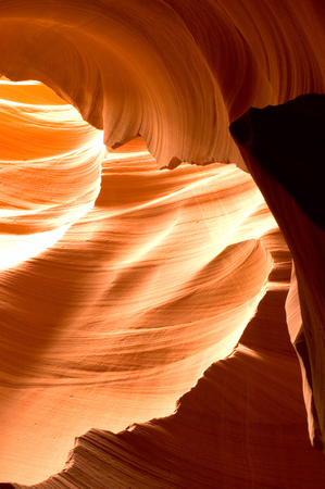 Sunlight reflected off of the red rock curves of the Antelope Canyon Slot Canyons in Page, Arizona. This shot was taken in Lower Antelope Canyon. 

Antelope Canyon is Mother Nature's work in progress. The canyon is carved from the flash flood waters of thの写真素材