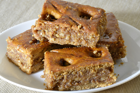 Turkish baklava with walnuts on a white plateの写真素材