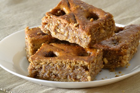 Turkish baklava with walnuts on a white plateの写真素材