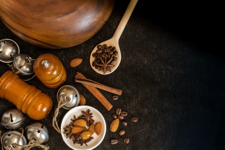 Food ingredients for cooking. Star anise, cinnamon sticks, almonds on a black backgroundの写真素材