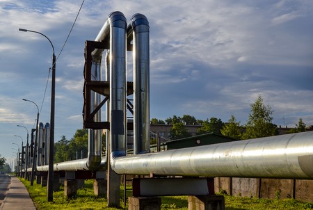 Overground heat pipes. Pipeline above the earth conducting heat for heating cityの写真素材
