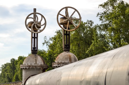 Two large pipeline valves on the heating main pipesの写真素材