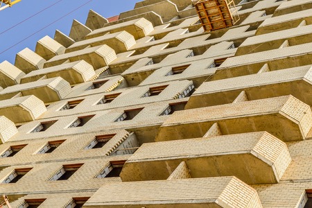 New residential building construction in process. Unfinished multi storey building.の写真素材